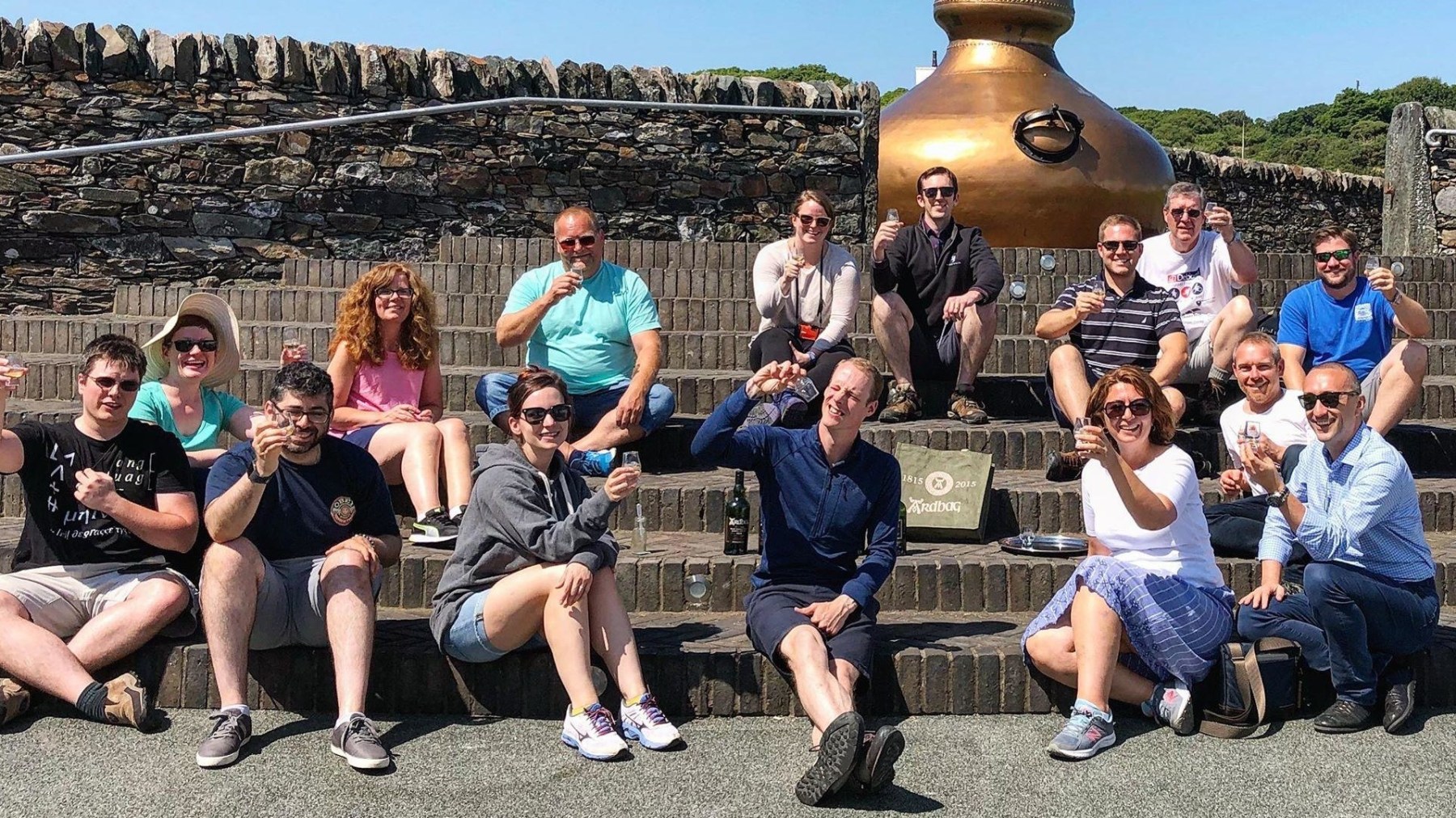 a group of people sitting on a bench